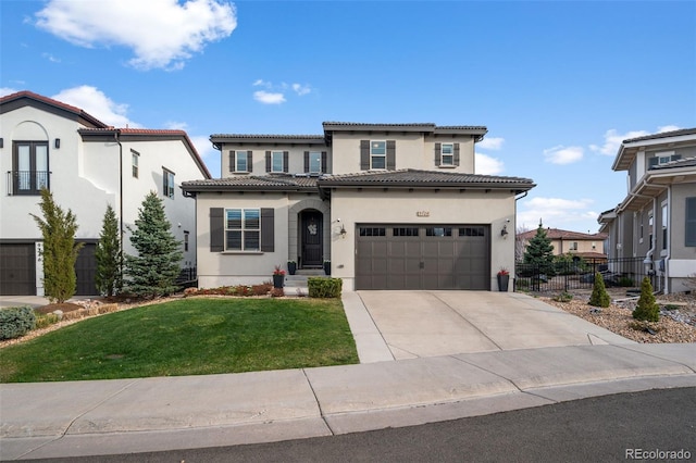 9724 Cantabria Pt, Lone Tree, CO 80124 - mediterranean / spanish-style home with stucco siding, driveway, a tiled roof, and a garage