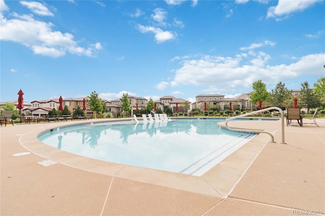 9724 Cantabria Pt, Lone Tree, CO 80124 - community pool featuring a residential view and a patio