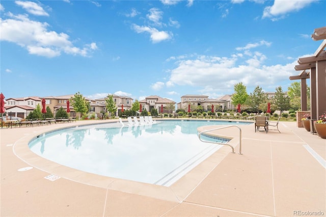 9724 Cantabria Pt, Lone Tree, CO 80124 - community pool with a residential view and a patio