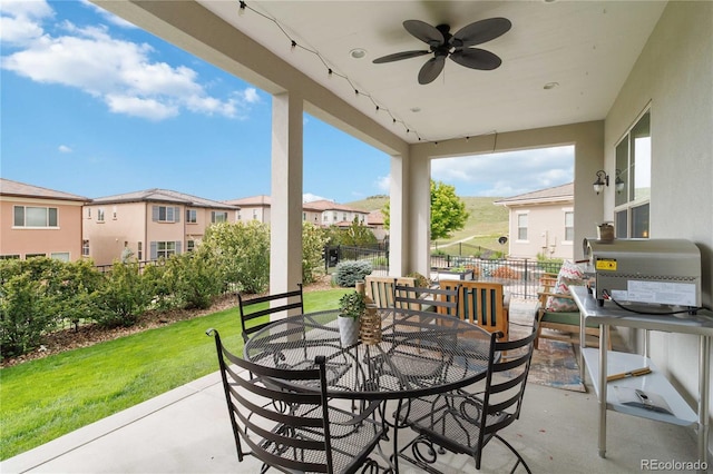 9724 Cantabria Pt, Lone Tree, CO 80124 - view of patio / terrace with outdoor dining space, a ceiling fan, and a residential view