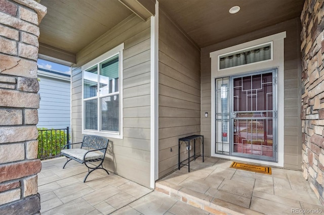 doorway to property featuring covered porch