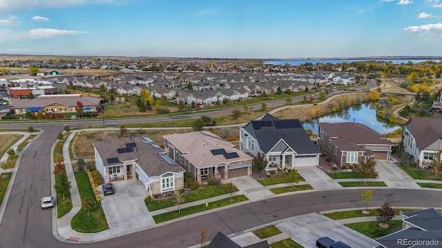 bird's eye view featuring a water view and a residential view