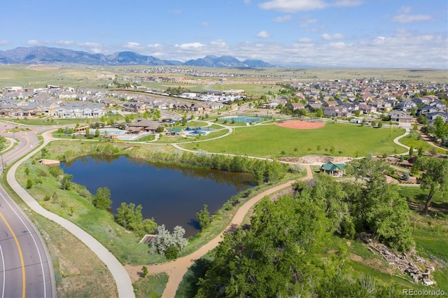 birds eye view of property with a water and mountain view and a residential view