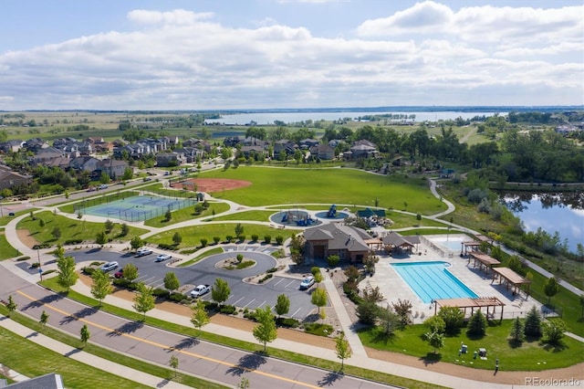 birds eye view of property with a water view