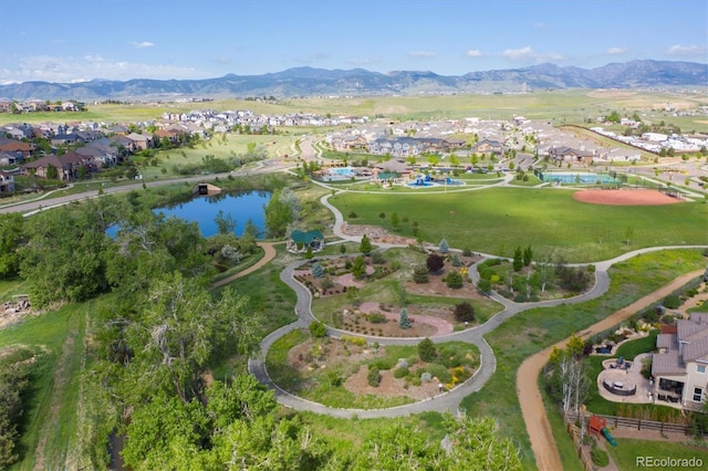 drone / aerial view featuring a residential view and a mountain view