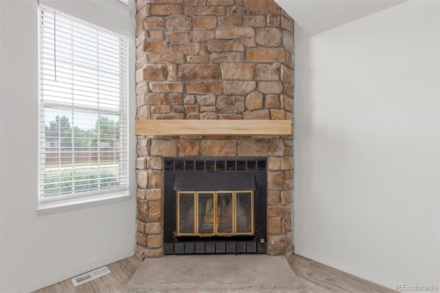 3281 S Estes St, Lakewood, CO 80227 - detailed view of a fireplace and wood finished floors