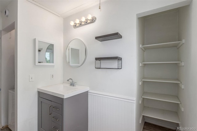 3281 S Estes St, Lakewood, CO 80227 - bathroom with vanity and a wainscoted wall