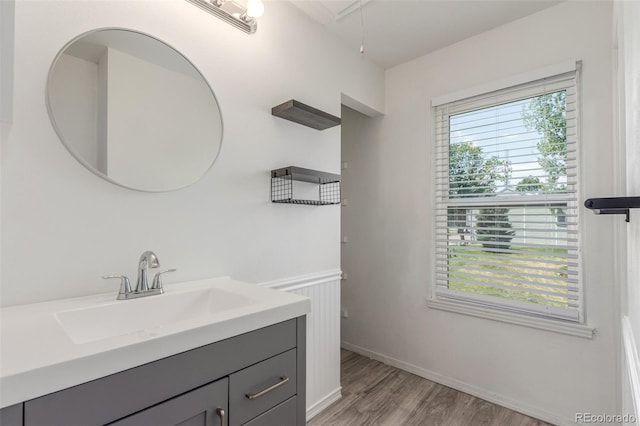 3281 S Estes St, Lakewood, CO 80227 - bathroom featuring vanity and wood finished floors
