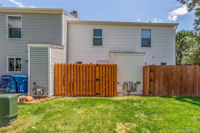 3281 S Estes St, Lakewood, CO 80227 - back of house featuring a gate