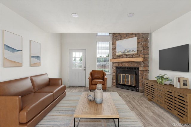3281 S Estes St, Lakewood, CO 80227 - living area with wood finished floors and a fireplace