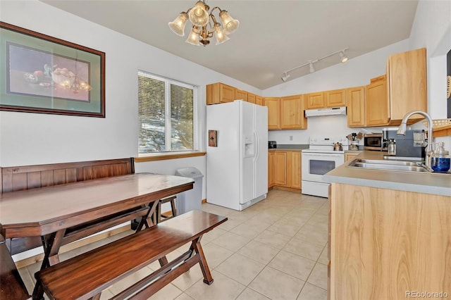 kitchen with lofted ceiling, white appliances, sink, and light brown cabinetry