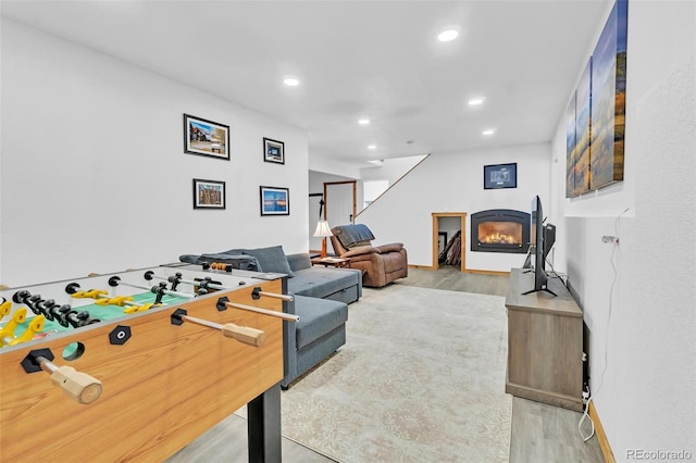 recreation room with wood-type flooring