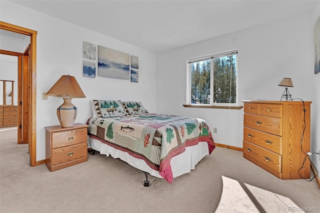 bedroom featuring light carpet