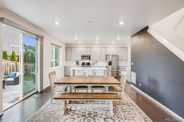 16673 E Virginia Ave, Aurora, CO 80017 - dining area featuring dark wood-style flooring, baseboards, and recessed lighting