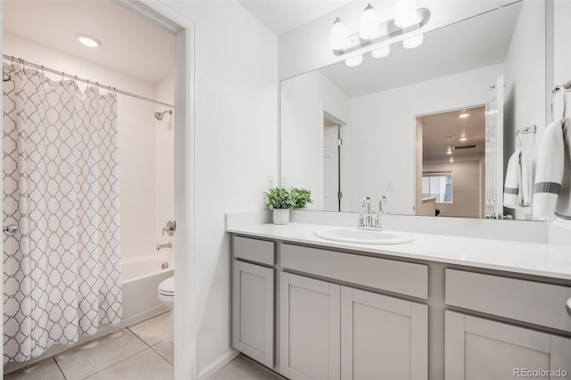 16673 E Virginia Ave, Aurora, CO 80017 - full bathroom featuring vanity, shower / bath combination with curtain, tile patterned floors, and toilet