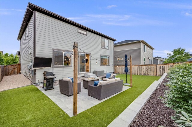 16673 E Virginia Ave, Aurora, CO 80017 - back of property featuring an outdoor living space and a patio area