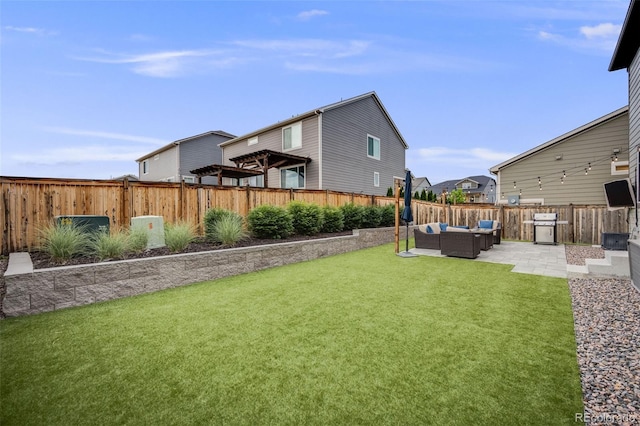 16673 E Virginia Ave, Aurora, CO 80017 - view of yard with an outdoor hangout area and a patio area