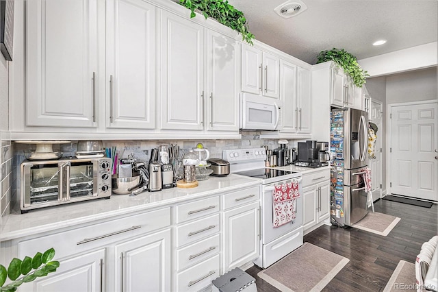 kitchen with white cabinetry, white appliances, visible vents, and decorative backsplash