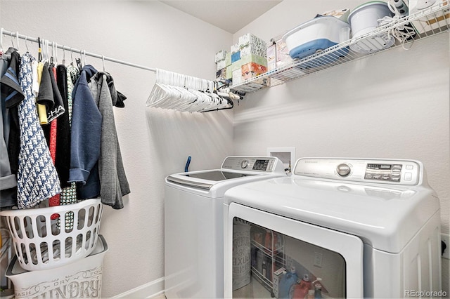 laundry room with laundry area and washer and clothes dryer