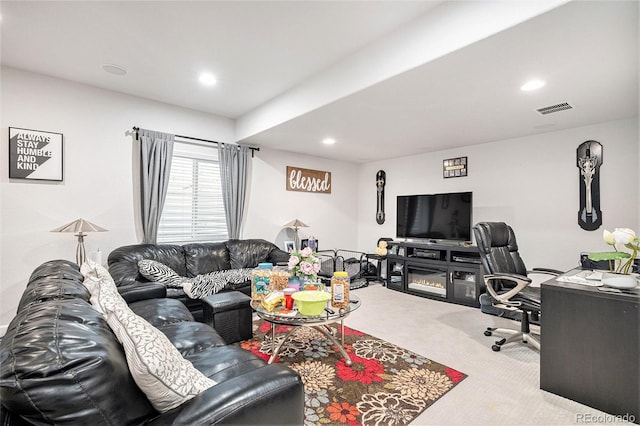 carpeted living room featuring visible vents and recessed lighting