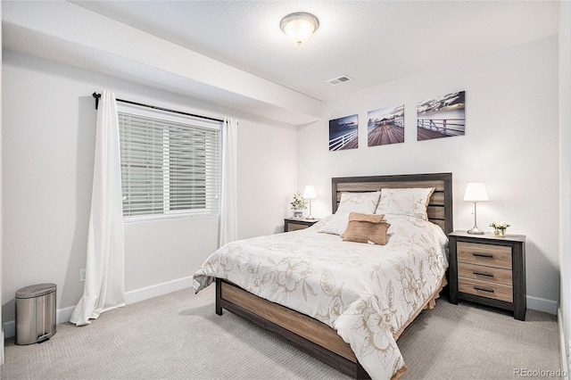 bedroom with visible vents, baseboards, and carpet flooring