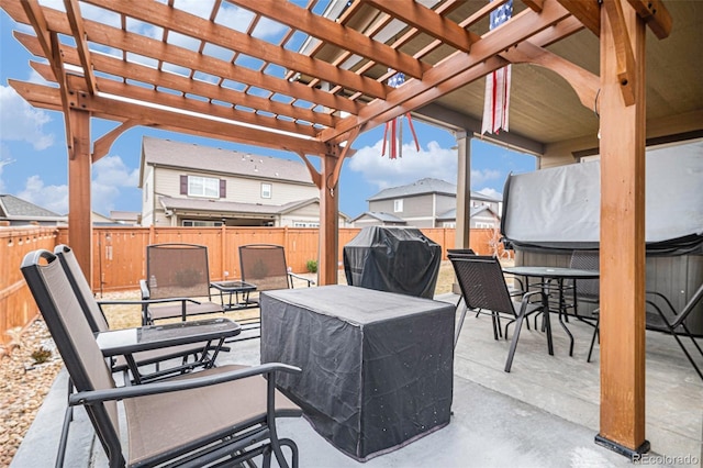 view of patio / terrace with a hot tub, outdoor dining area, a fenced backyard, a grill, and a pergola