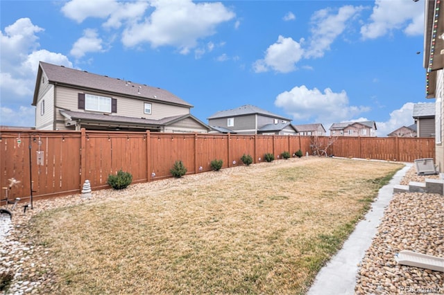 view of yard with a fenced backyard