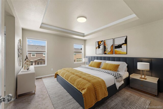 19131 E 65th Ave, Denver, CO 80249 - carpeted bedroom with a tray ceiling and baseboards