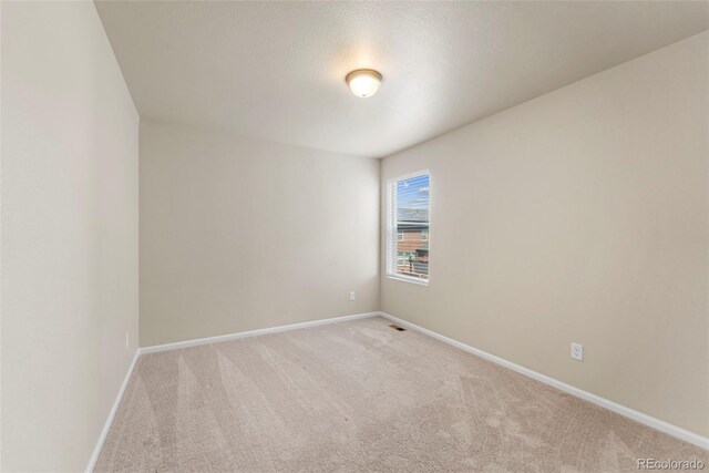 19131 E 65th Ave, Denver, CO 80249 - unfurnished room featuring light colored carpet and baseboards