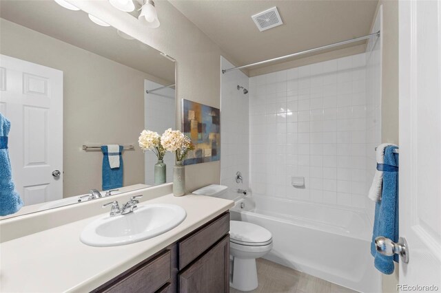 19131 E 65th Ave, Denver, CO 80249 - full bathroom featuring vanity, toilet, and bathing tub / shower combination