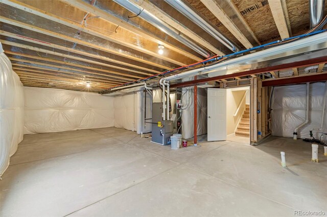 19131 E 65th Ave, Denver, CO 80249 - unfinished basement featuring heating unit and stairway