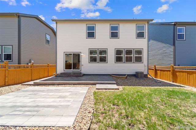 19131 E 65th Ave, Denver, CO 80249 - rear view of house featuring a patio and central AC