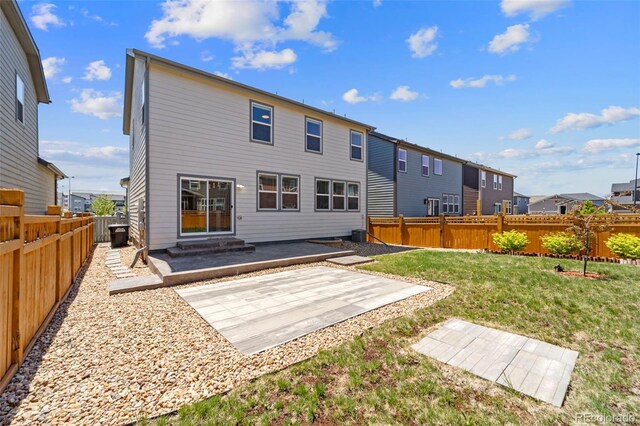 19131 E 65th Ave, Denver, CO 80249 - back of house with a patio and a residential view