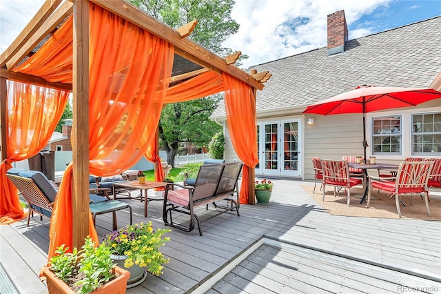 wooden deck with french doors and outdoor dining space