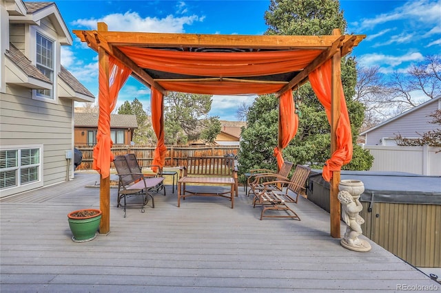 deck with fence and a hot tub