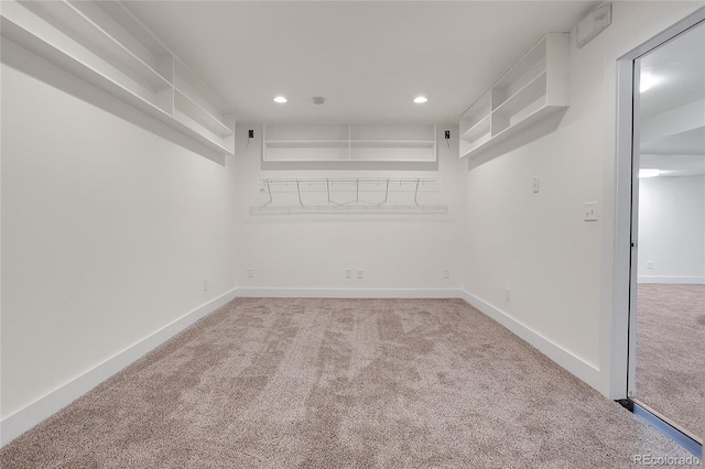 spacious closet with carpet flooring