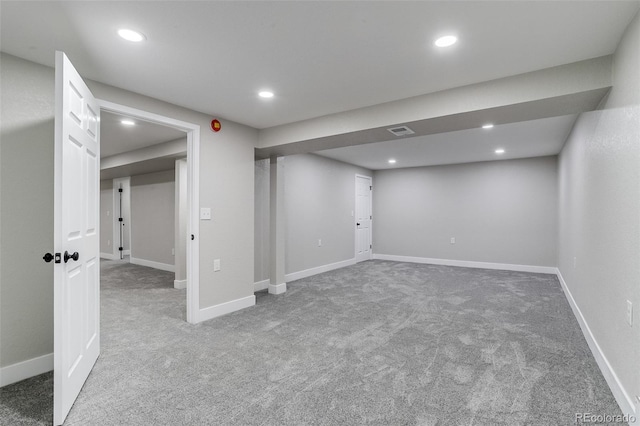finished basement with visible vents, recessed lighting, and carpet