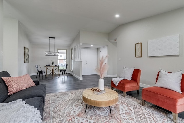 living room with lofted ceiling, baseboards, recessed lighting, and wood finished floors