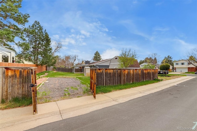 exterior space with fence private yard and a residential view