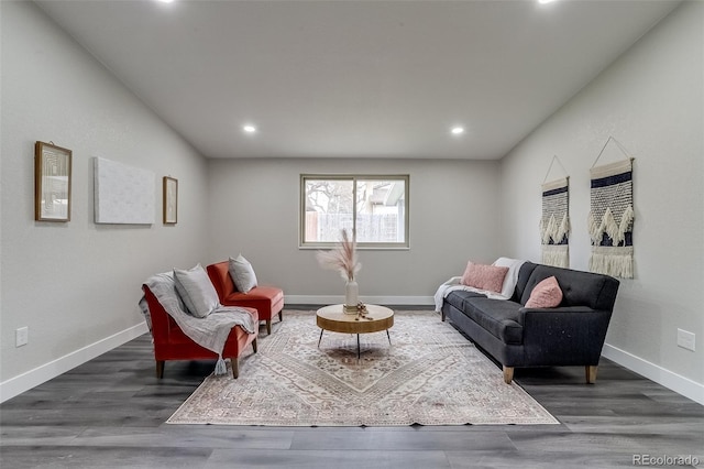 living room with recessed lighting, baseboards, and wood finished floors