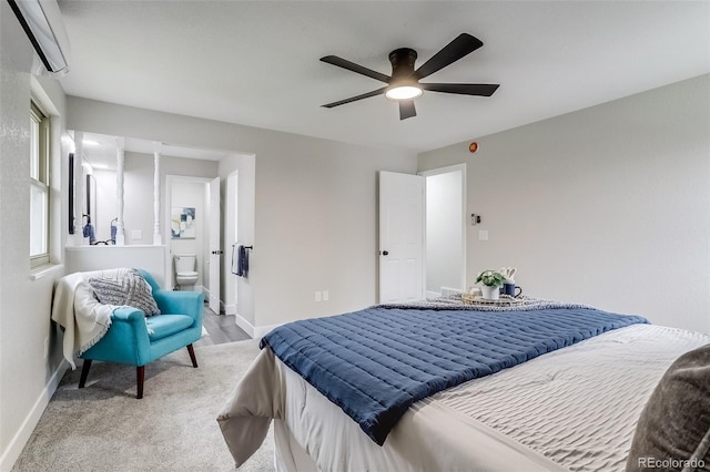 bedroom with carpet, ensuite bathroom, baseboards, and a ceiling fan