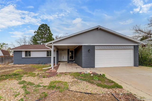 single story home with fence, an attached garage, brick siding, and driveway