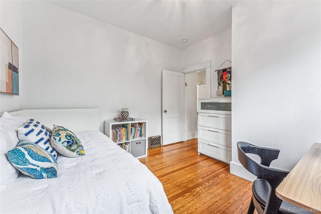 bedroom with light wood-type flooring