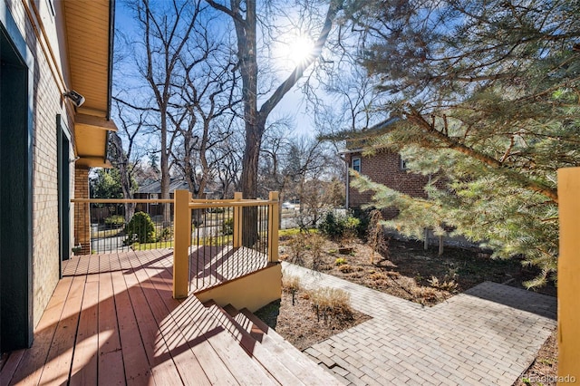 wooden terrace featuring a patio