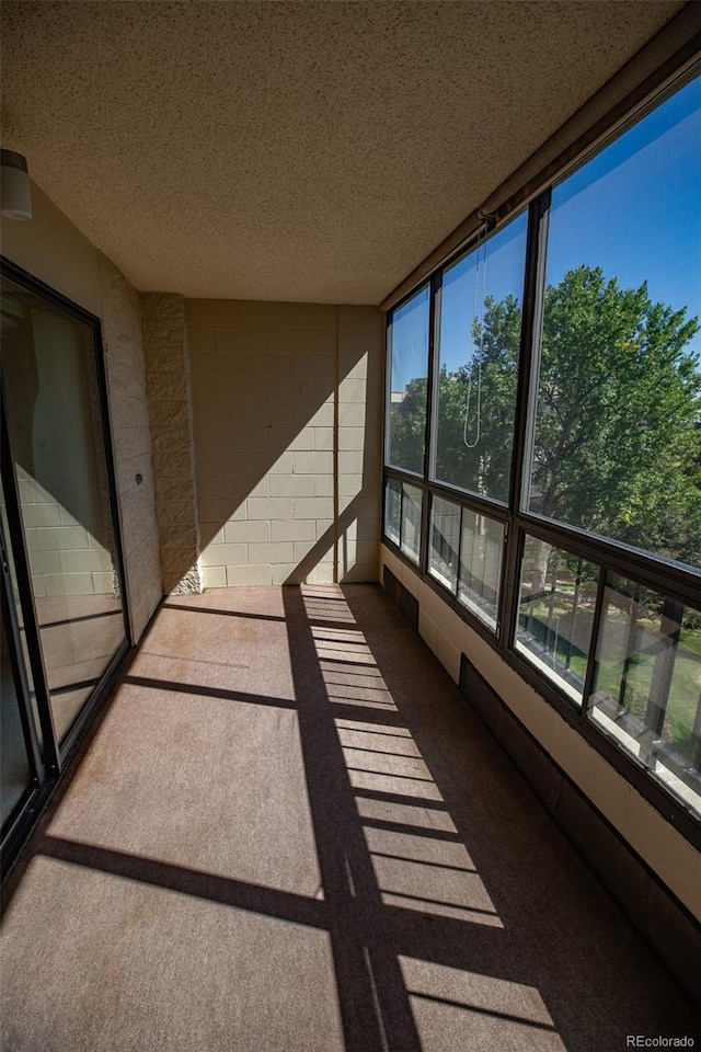 unfurnished sunroom with plenty of natural light