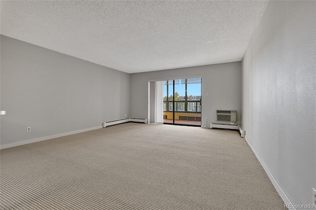 empty room with light carpet, baseboard heating, a wall mounted AC, and baseboards