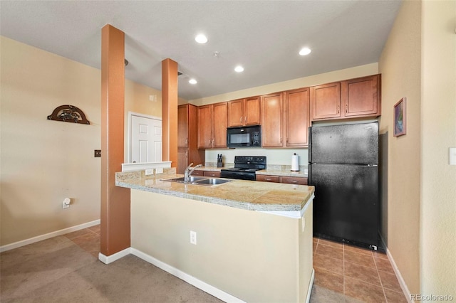 kitchen featuring kitchen peninsula, sink, light tile patterned floors, and black appliances