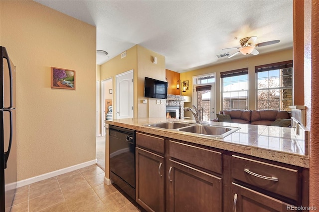 kitchen with ceiling fan, black dishwasher, dark brown cabinetry, and sink