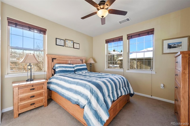 bedroom featuring ceiling fan and light carpet