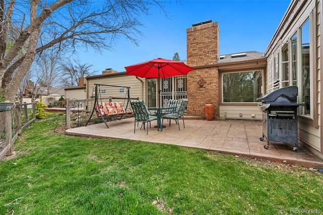 exterior space featuring fence and area for grilling